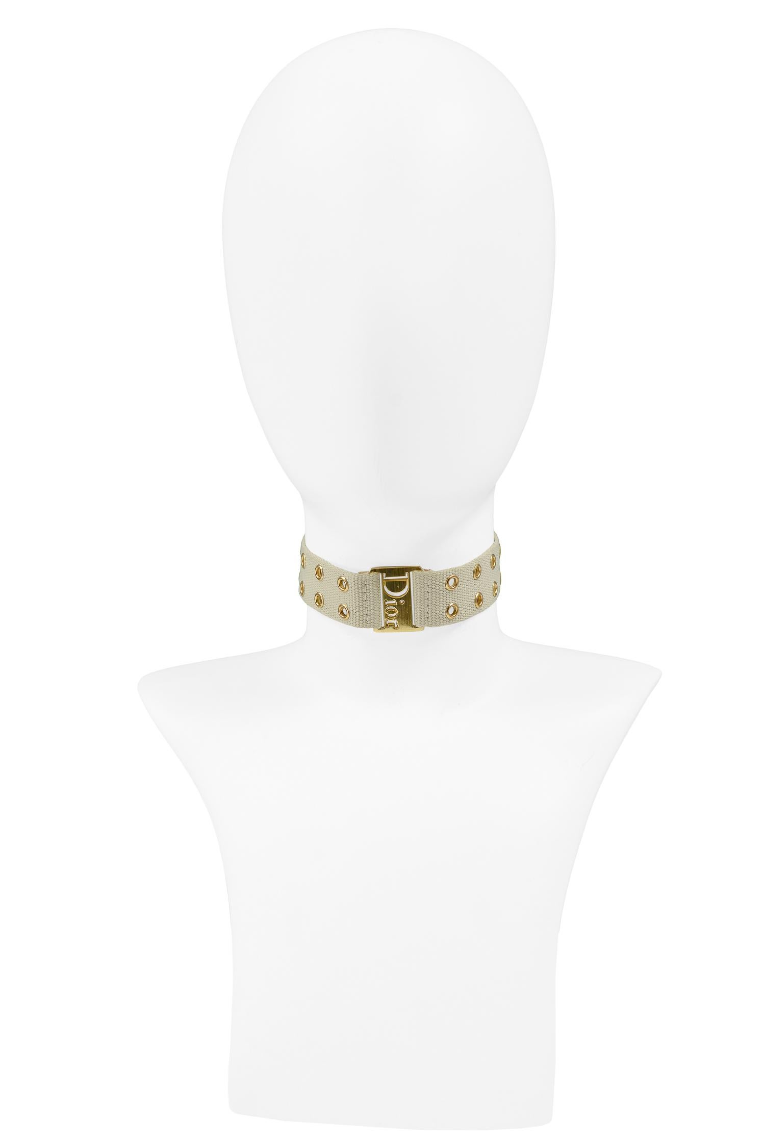 Resurrection is pleased to offer a vintage Christian Dior khaki choker featuring gold hardware, eyelets, and Dior embossed onto the front.

Christian Dior Paris
Designed by John Galliano
One Size
Excellent Vintage Condition
Authenticity Guaranteed 