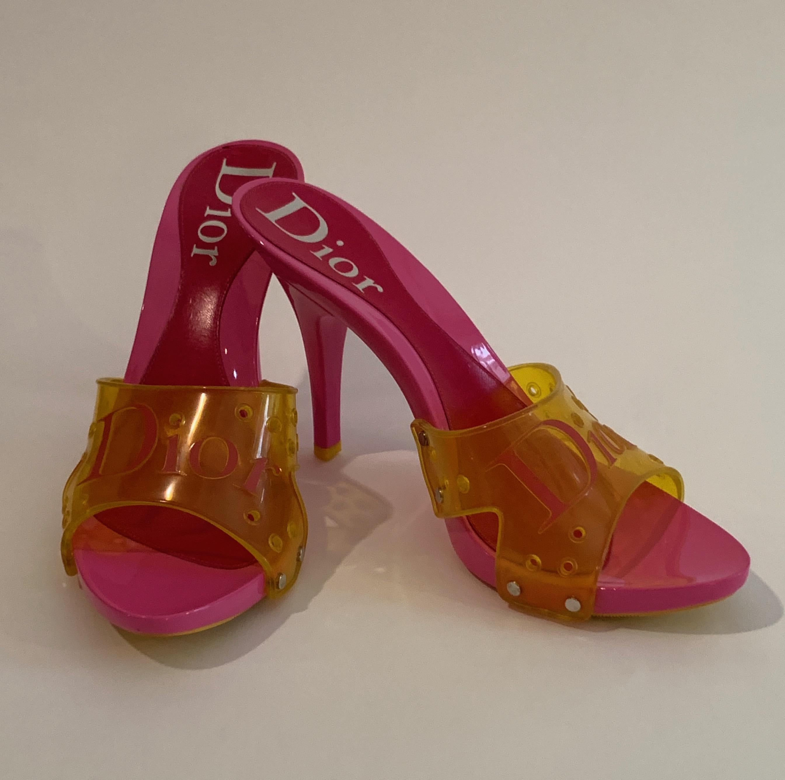 Christian Dior bright pink resin sandals with high heels and yellow PVC uppers with Pink Dior logo and perforated detailing. Heels approximately 4 1/2