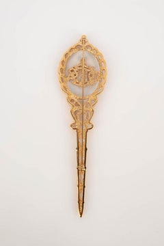 Broche largo Dior de metal dorado