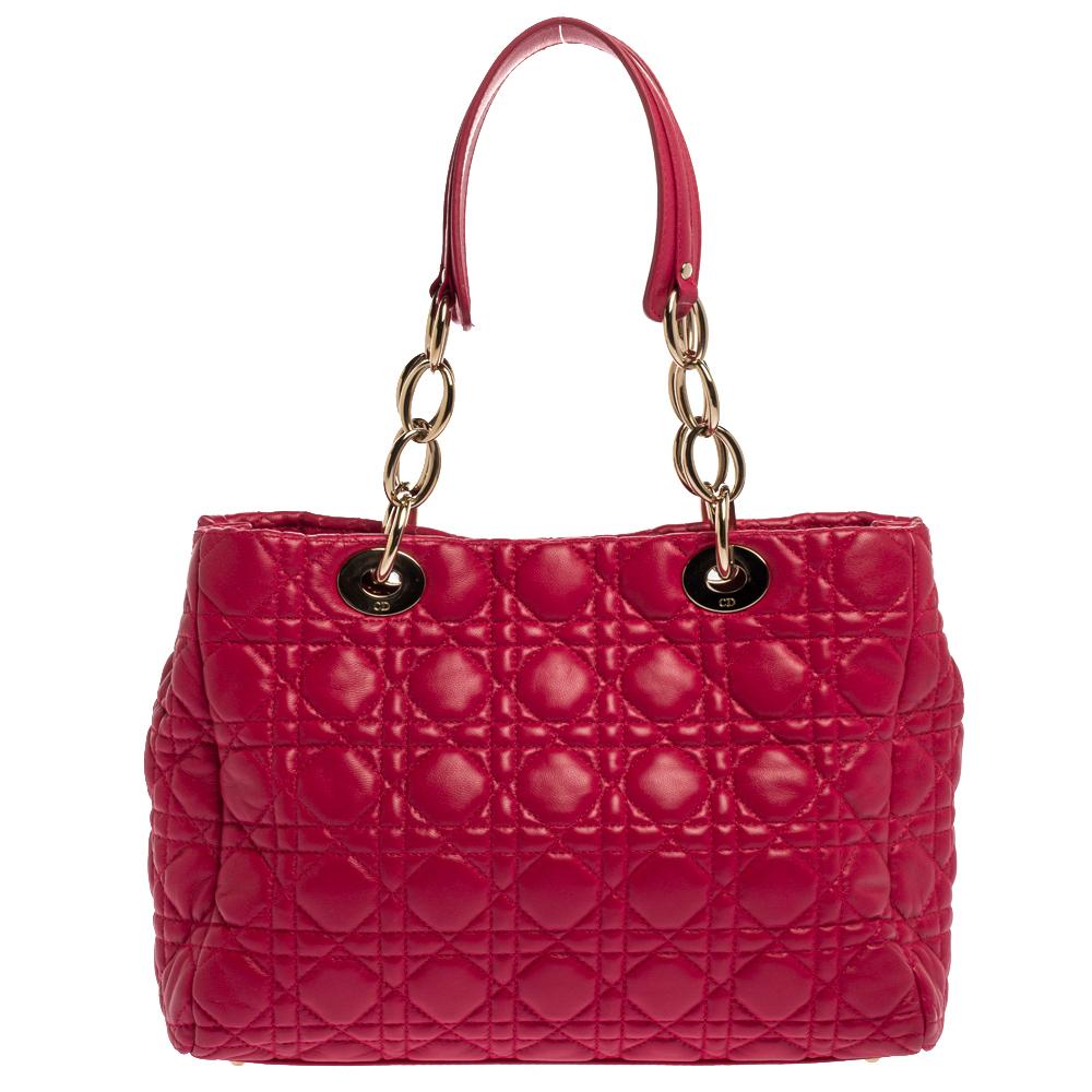 The Lady Dior tote is a Dior creation that has gained recognition worldwide and is today a coveted bag that every fashionista craves to possess. This pink Shopping tote has been crafted from leather and it carries the signature Cannage quilt. It is