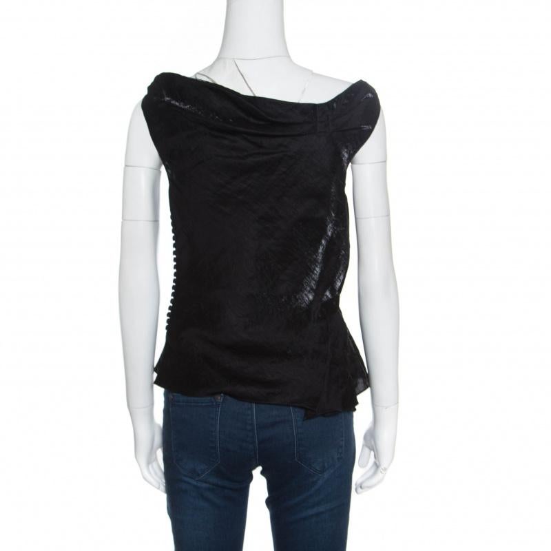 This top from Dior is one item your closet will love. Tailored from quality fabrics, it has a gorgeous draped neckline and a sleeveless style. Cut into a silhouette that is feminine and stylish, this black number is a must-buy.

Includes: Packaging