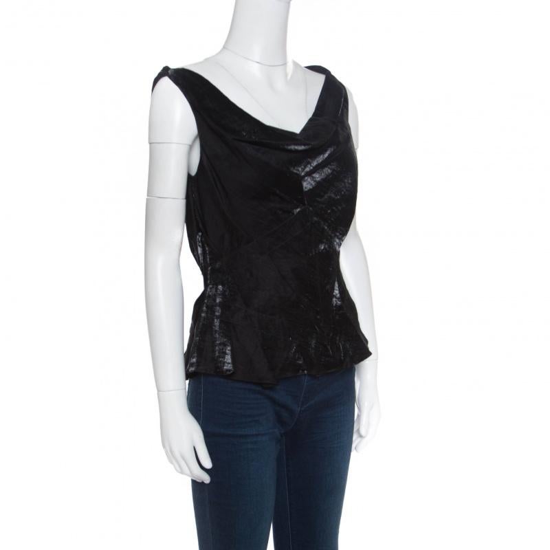 This top from Dior is one item your closet will love. Tailored from quality fabrics, it has a gorgeous draped neckline and a sleeveless style. Cut into a silhouette that is feminine and stylish, this black number is a must-buy.

Includes: The Luxury