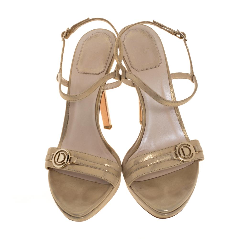 There's nothing we don't love about these gorgeous sandals from Dior! The lovely sandals are crafted from gold fabric and feature open toes, logo detailed vamp straps, ankle straps with buckle fastenings, and platforms that support the 11.5 cm