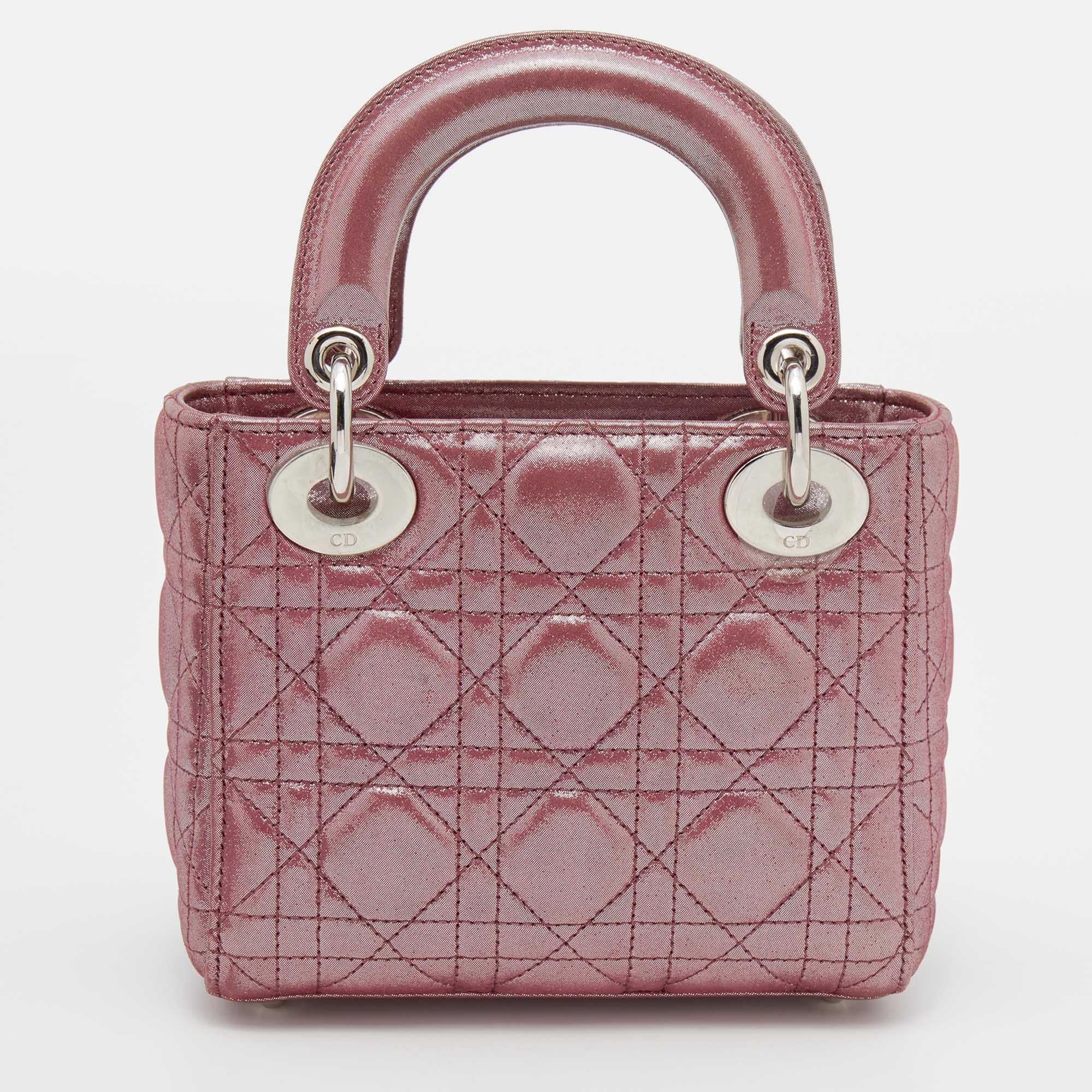 The Lady Dior tote is a Dior creation that has gained recognition worldwide and is today a coveted bag that every fashionista craves to possess. This mini tote has been crafted from leather and it carries the signature Cannage quilt. It is equipped