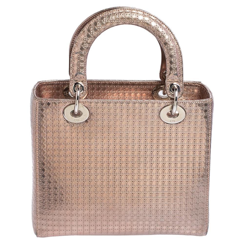 he Lady Dior tote is a Dior creation that has gained recognition worldwide and is today a coveted bag that every fashionista craves to possess. This metallic rose gold tote has been crafted from leather and it carries the signature Micro Cannage