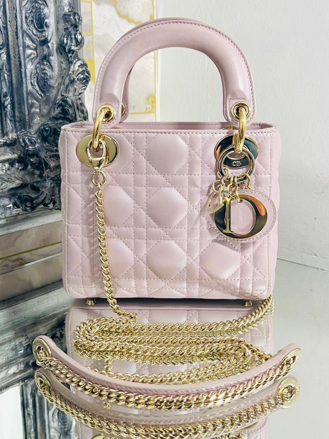  Dior Mini Lady Dior Leather Bag With Chain Strap 

Iridescent pink, Lambskin leather bag with Champagne gold hardware.

Signature cannage stitching,  D.I.O.R. dangle charm embellishment and a 

 removable chain shoulder strap, the  bag can be