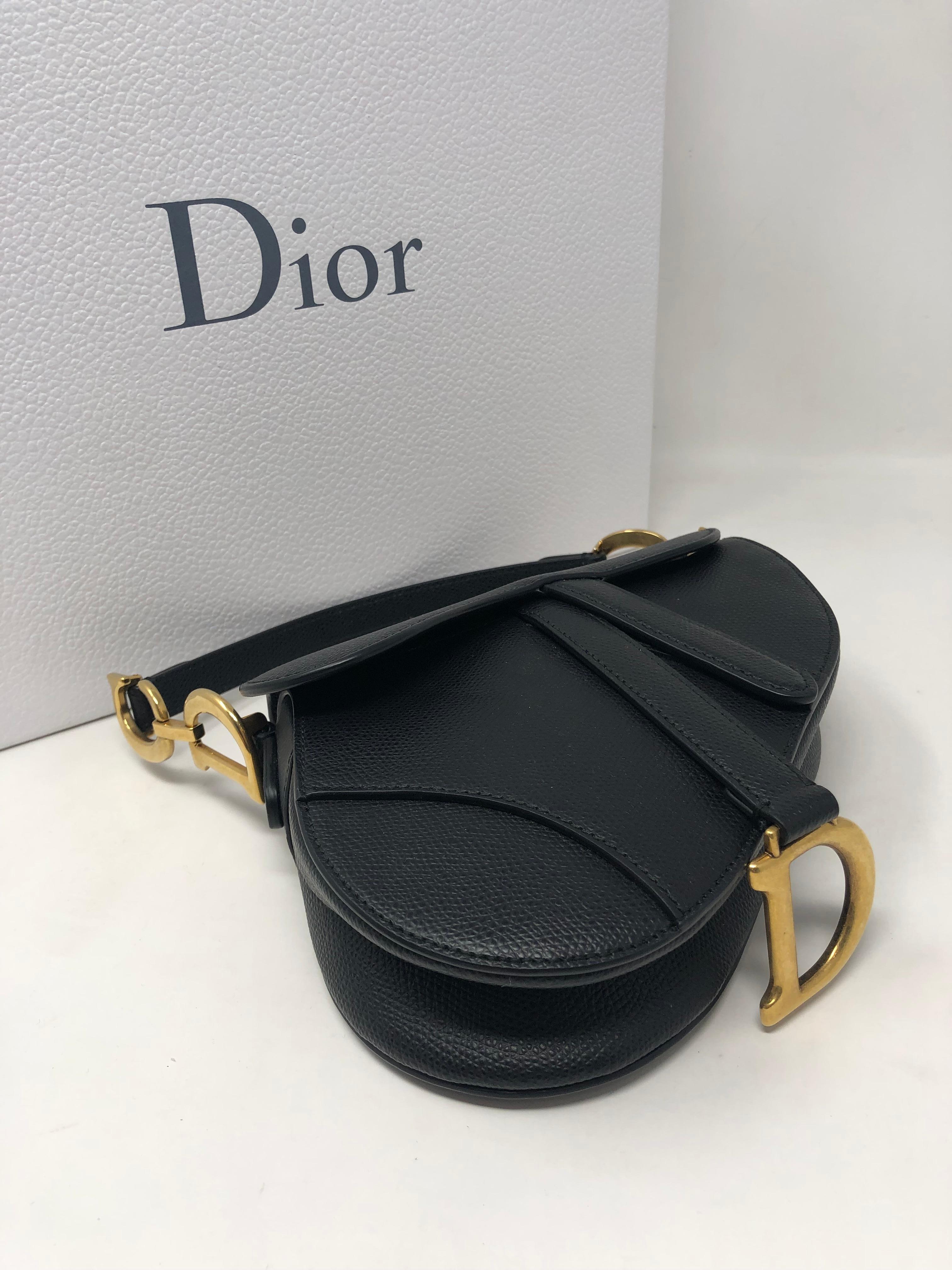 Dior Black Mini Saddle Bag. Mini size with gold hardware. Black calfskin leather. Never worn. Brand new with dust cover and box. Includes original receipt. Guaranteed authentic. 