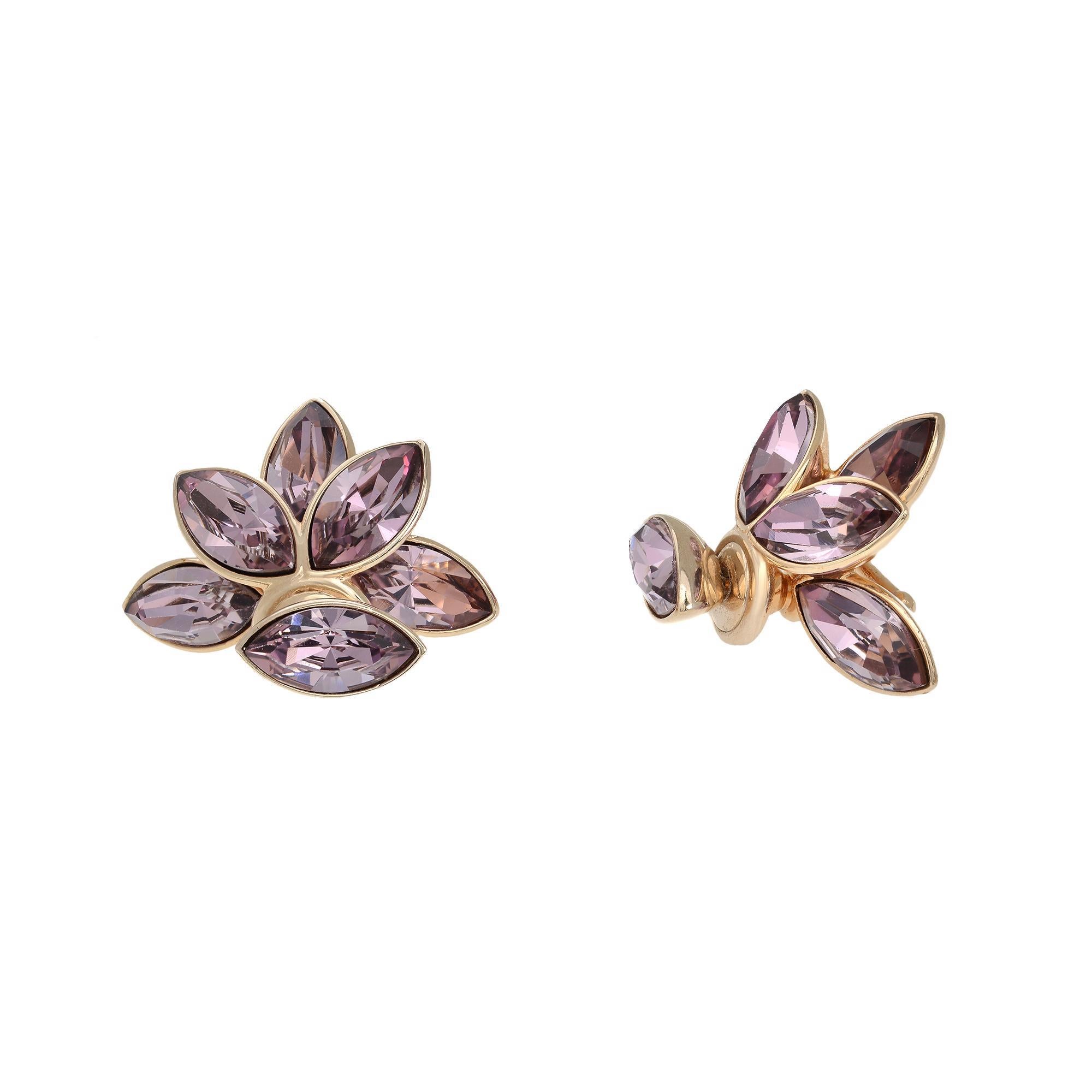 Purple crystal Mise En Tribal flower petal Stud Earrings crafted in gold tone. These gold tone metal earrings showcase crystal flowers at the back and a petal motif on the front. Earring size: 23x15mm. Excellent preowned condition. The original box