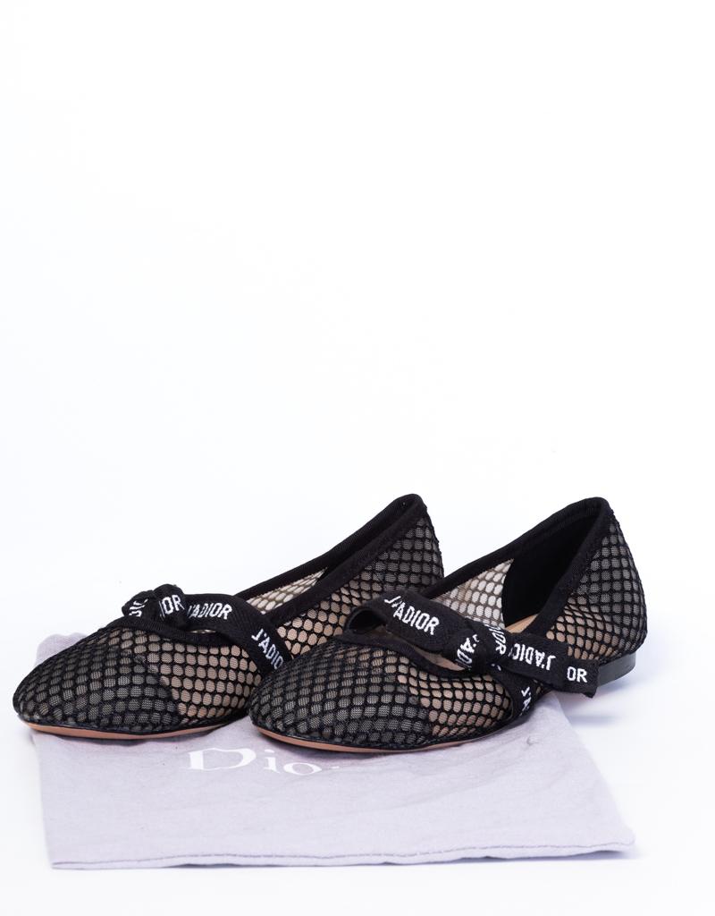 Ballerina flats by Dior made of black mesh fabric with a leather sole. Featuring a flat embroidered ribbon bow at vamp.

COLOR: Black
MATERIAL: Mesh and leather
SIZE: 36 EU / 5 US
ORIGINAL RETAIL: $1095
COMES WITH: Dust bag
CONDITION: Great
