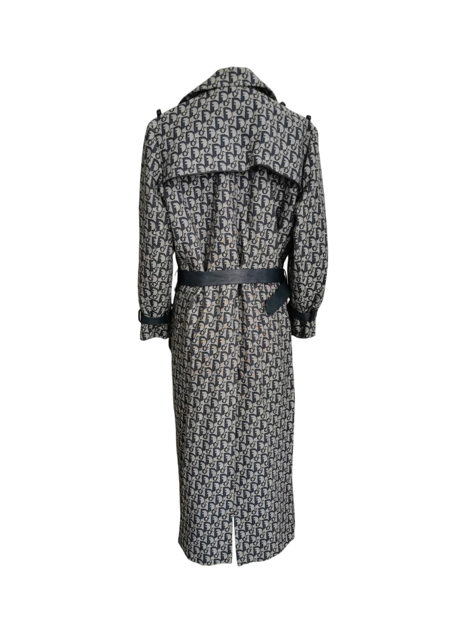 “Welcome to all our Super Fly Girls” (Vogue, 2000). This stunning Dior by John Galliano denim coat has their signature monogram print. The coat features the C D signature buttons and a big leather belt with a D shaped closure. This vintage piece