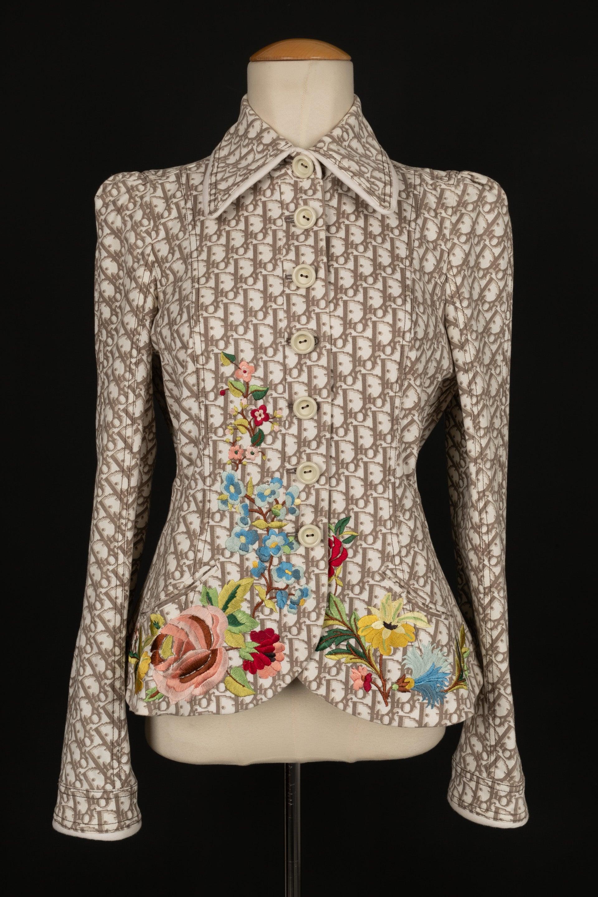 Dior - (Made in France) Monogrammed cotton jacket embroidered with flowers. No size nor composition label, it fits a 36FR. Spring-Summer 2005 Ready-to-Wear Collection under the artistic direction of John Galliano.

Additional information:
Condition: