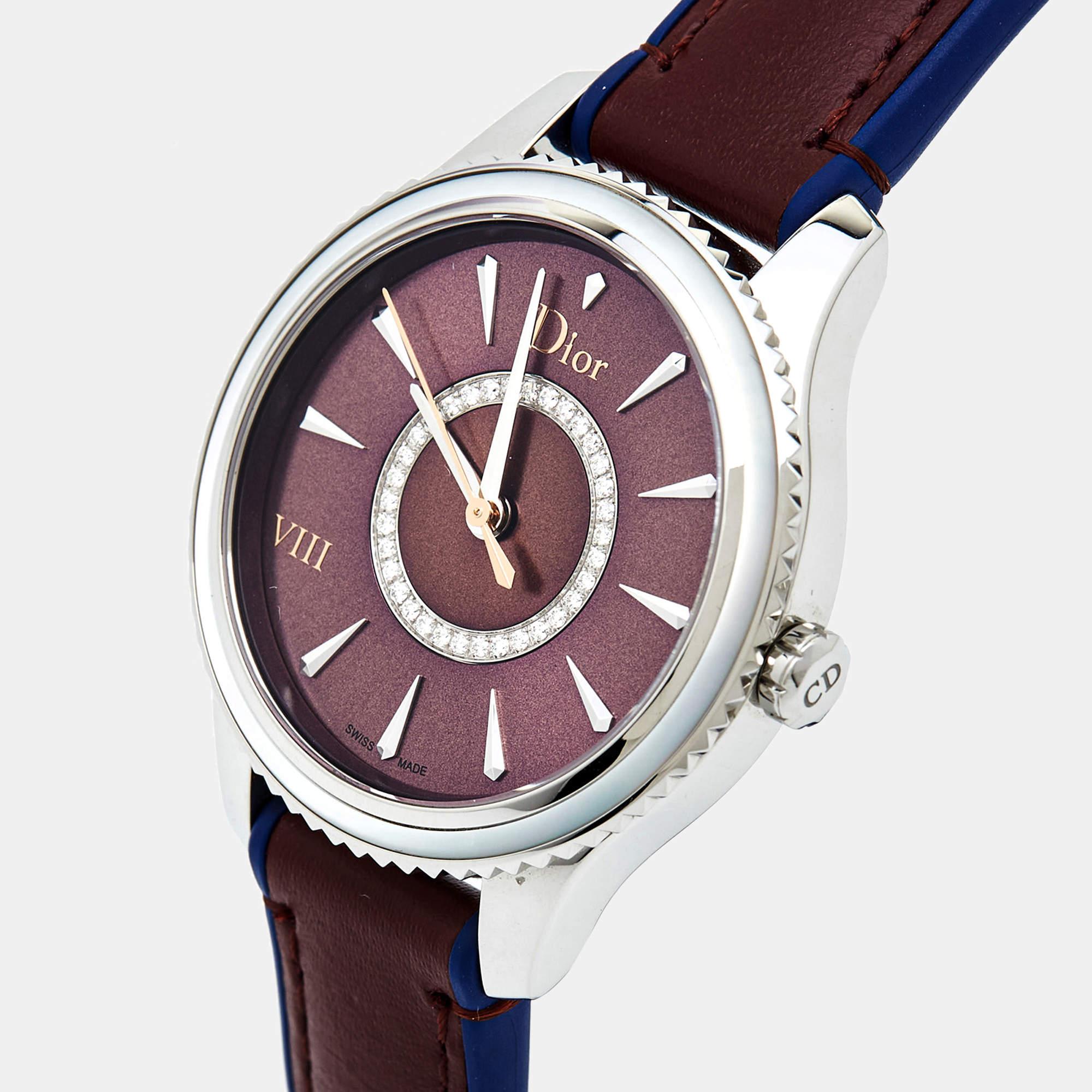 The Dior wristwatch combines opulence and precision. Its stainless steel case is adorned with a rich burgundy leather strap. The dial features a mesmerizing mother-of-pearl finish, enhancing its luxurious appeal. This timepiece from the VIII Place