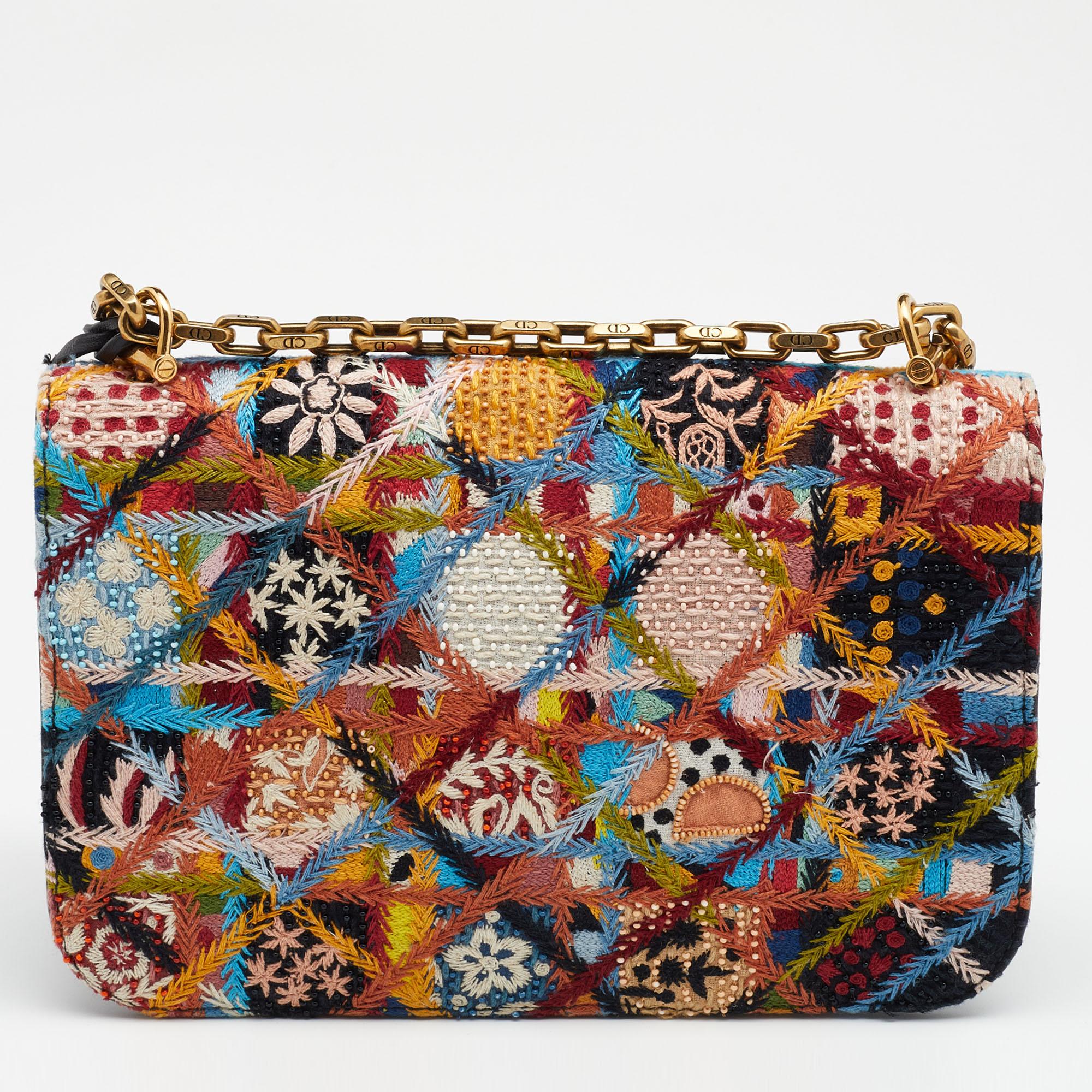 Dior created this Dioraddict bag to spark joy and give you a smile each time you take it out of your closet to complement or save an outfit. It's a super special piece made of intricately embroidered fabric bursting in pleasing colors. The bag is