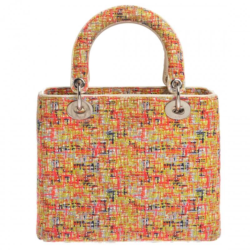 J’adore Dior indeed! We are absolutely smitten over this Limited Edition Lady Dior tote. Crafted from bright multicolored embroidered fabric and adorned with silver-tone hardware, this bag is fun and feminine. Accented with white leather details, it