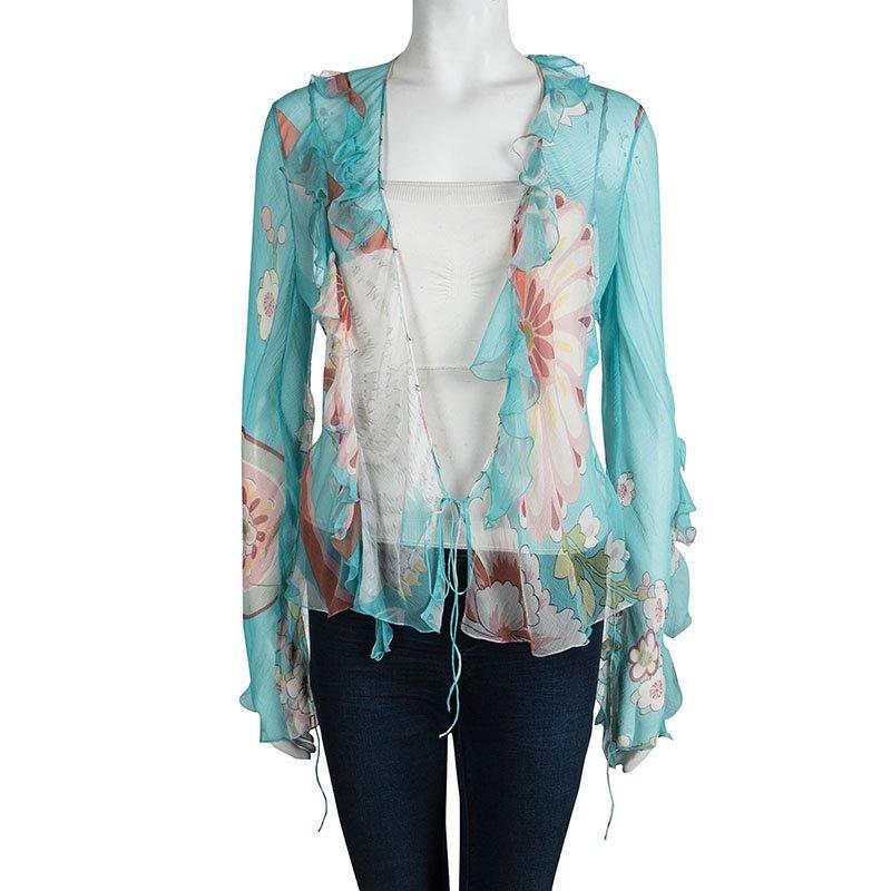 A great summer piece this Dior multicolored floral printed sheer silk blouse will be a perfect addition to your closet. If you love feminine designs and soft silhouettes this long sleeved ruffled piece is for you. The blouse ties in at the front