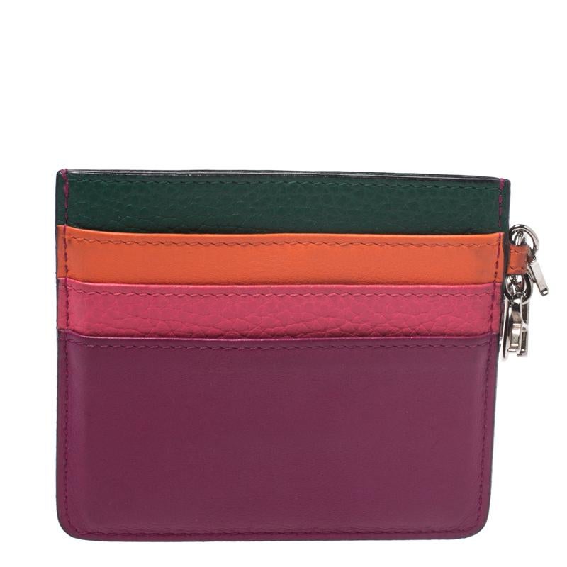 This stylish and functional cardholder from Dior makes for a great accessory. Crafted from quality leather in Italy, it carries lovely multicolor hues. It has multiple card slots on the exterior and enough space inside to hold your essentials. It is