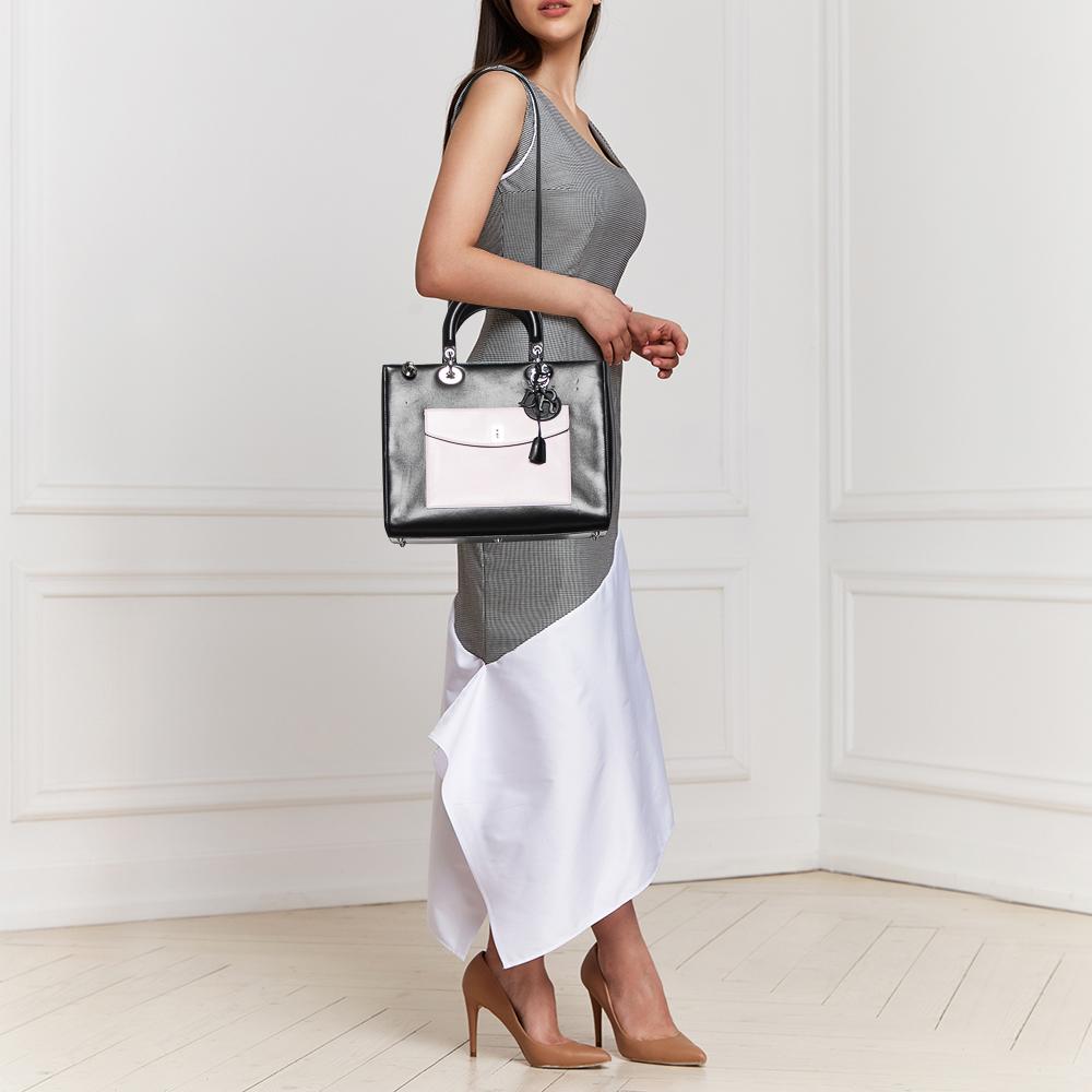 The architectural shape of this Dior tote makes it distinct and fashionable. Made from premium materials, it can be carried around conveniently and it is equipped with a perfectly-sized interior.


Includes
Original Dustbag, Authenticity Card, Info