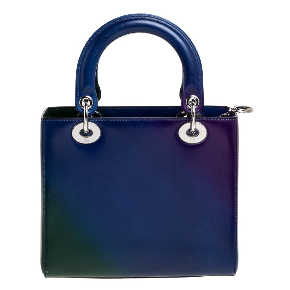 The Lady Dior tote is a Dior creation that has gained recognition worldwide and is today a coveted bag that every fashionista craves to possess. This tote has been crafted from leather and carries a multicolored ombre pattern. It is equipped with a