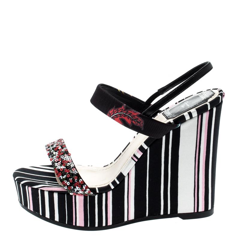 This Dior pair is designed in the printed stripes pattern with sequin embellishments on the front strap. Crafted from satin with leather trim, this multicolor creation features a 12cm heel, an ankle strap and a comfortable leather insole. Amp up