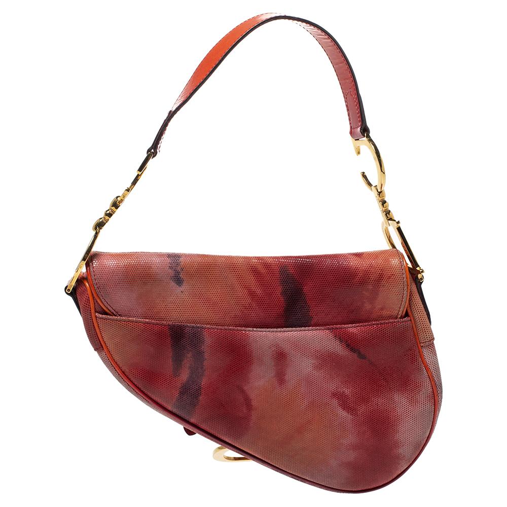 The Dior Saddle made a huge comeback in 2018 and it has gone on to remain in style. Just for you to catch on with the Saddle trend comes this gorgeous tie-dye version in suede and patent leather. A single handle and a nylon interior sum the creation
