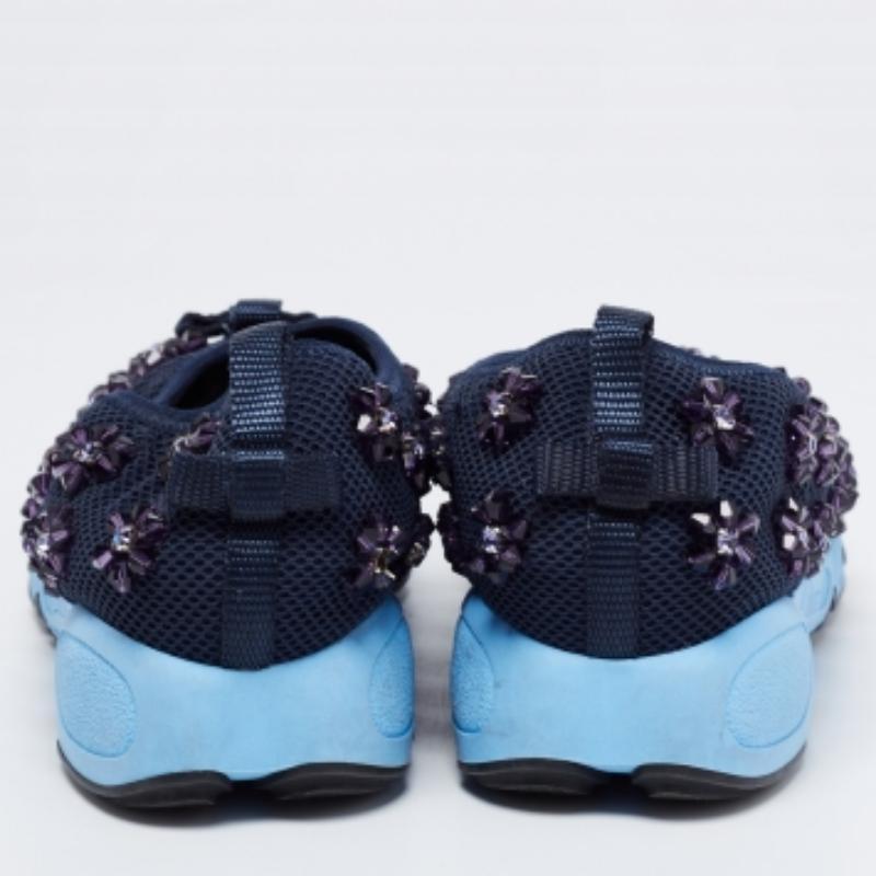 The words 'edgy' and 'ultra-modern' can be readily attributed to this pair from Dior. The sneakers were first introduced as a part of their Haute Couture Spring/Summer 2014 collection. Crafted from mesh, they feature dainty embellishments and rubber