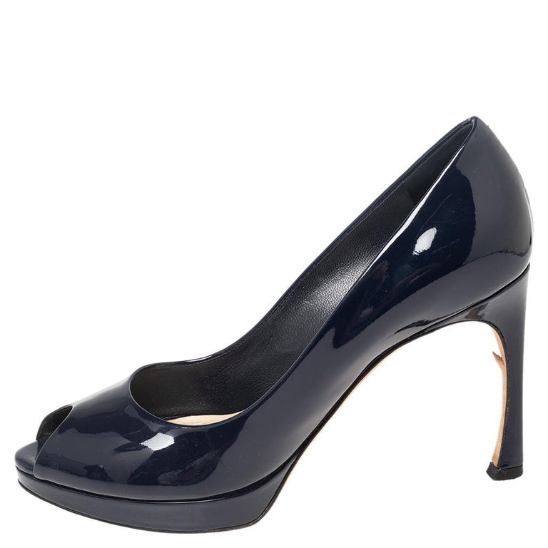 Crafted using blue glossy patent leather, these Dior pumps are meant to add a sophisticated finish to your look of the day. The designer pumps feature peep toes, platforms, and 11 cm heels.

Includes: Original Box, Extra Heel Tip
