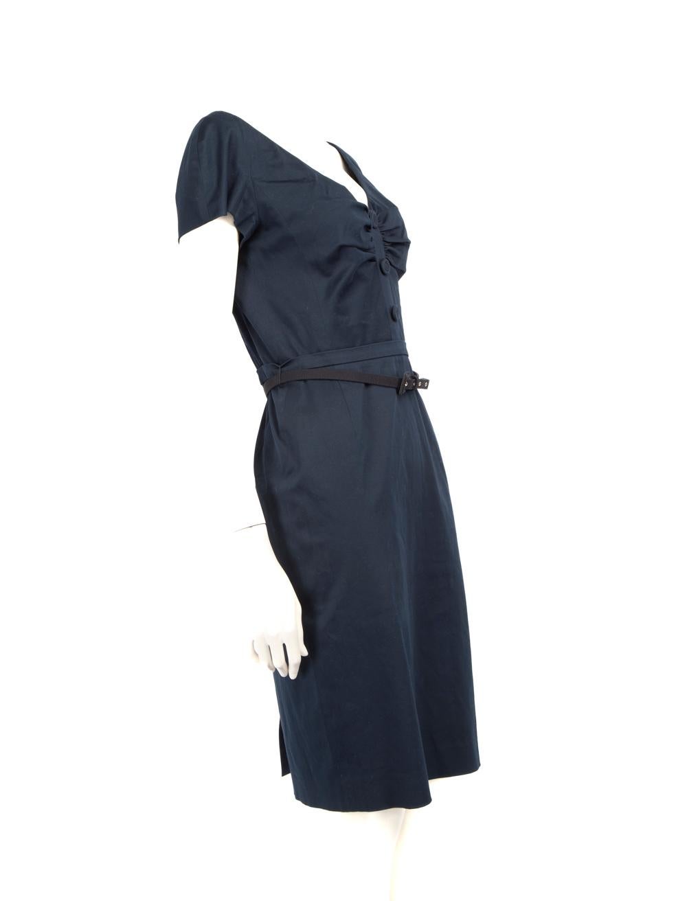 CONDITION is Good. General wear to dress is evident. Moderate signs of wear with discolouration on the inner armpit lining, logo label, on the bottom front and back at the belt level. The clip at the upper back closure is tarnished, and the belt