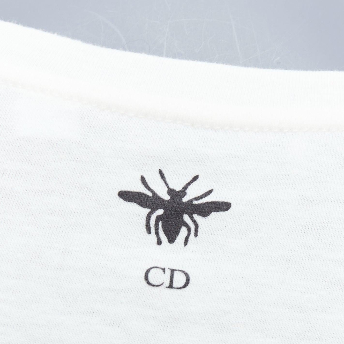 DIOR navy double bird astrology print white cotton linen short sleeve tshirt XS
Reference: AAWC/A00780
Brand: Dior
Designer: Maria Grazia Chiuri
Model: 243T09GE459
Material: Cotton, Linen
Color: Ecru, Navy
Pattern: Graphic
Extra Details: CD Bee logo