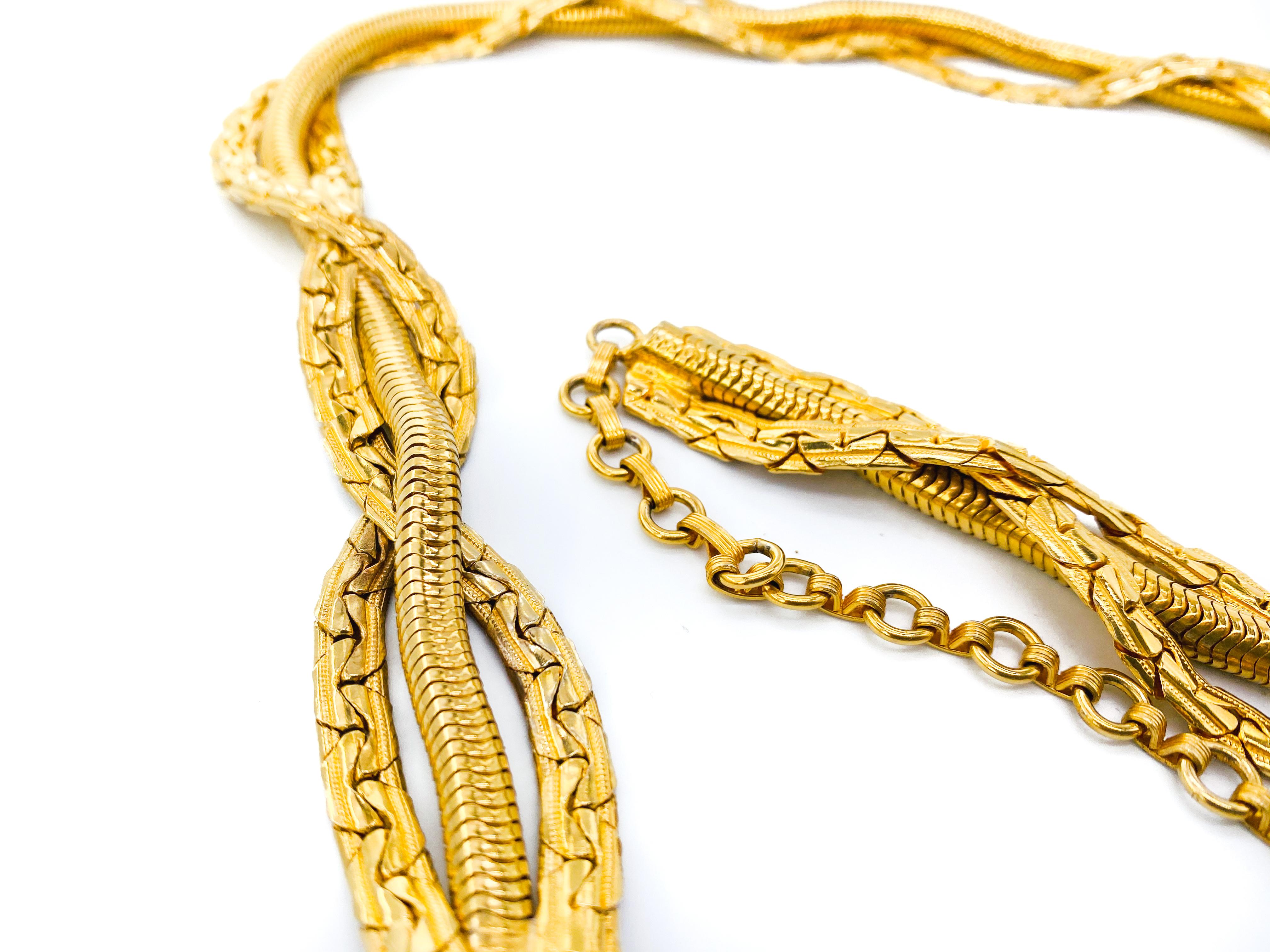 Dior Belt 1980s Vintage Necklace and Belt

A stunning piece from the 1980s Dior archive. Cast from a high quality gold plated metal, it features a delicately elaborate woven chain with a drop chain and pendant. 

Can be worn both as a belt and a