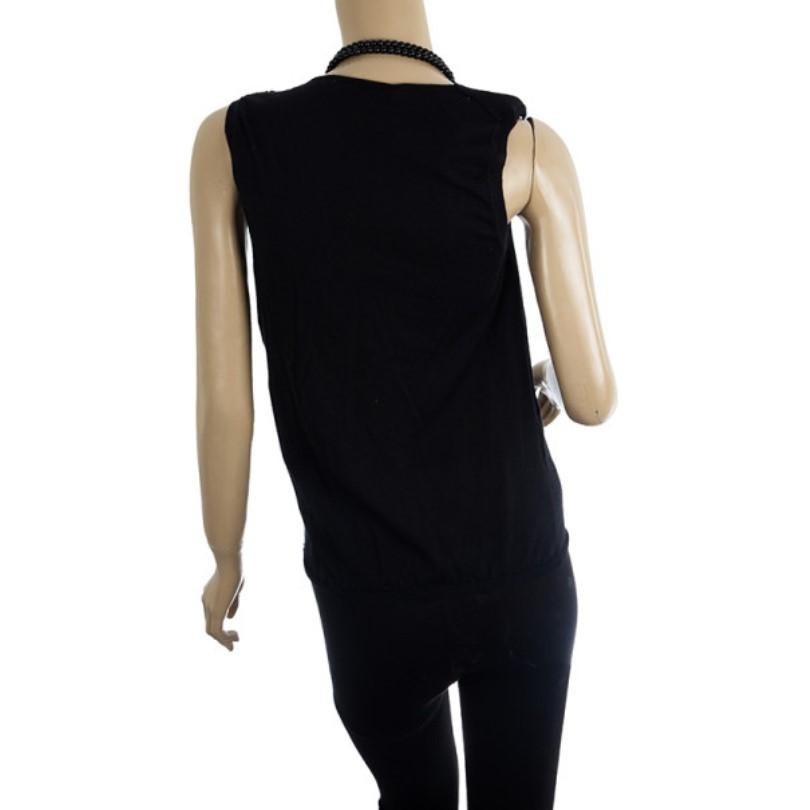 This Dior Black sleeveless top comes with black beaded necklace joint at the shoulder. It features an elasticized bottom hem and cowl neck.

Includes: The Luxury Closet Packaging

The Luxury Closet is an elite luxury reseller specializing in the