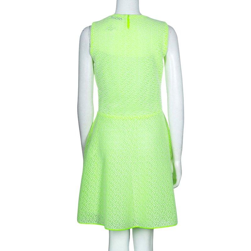 A florescent colors are back to be one of the hottest trends for this season. Embrace it by wearing this dress by Dior. Cut from a blended fabric, it comes in eye-catching neon green color and lined with silk for extra comfort. It features