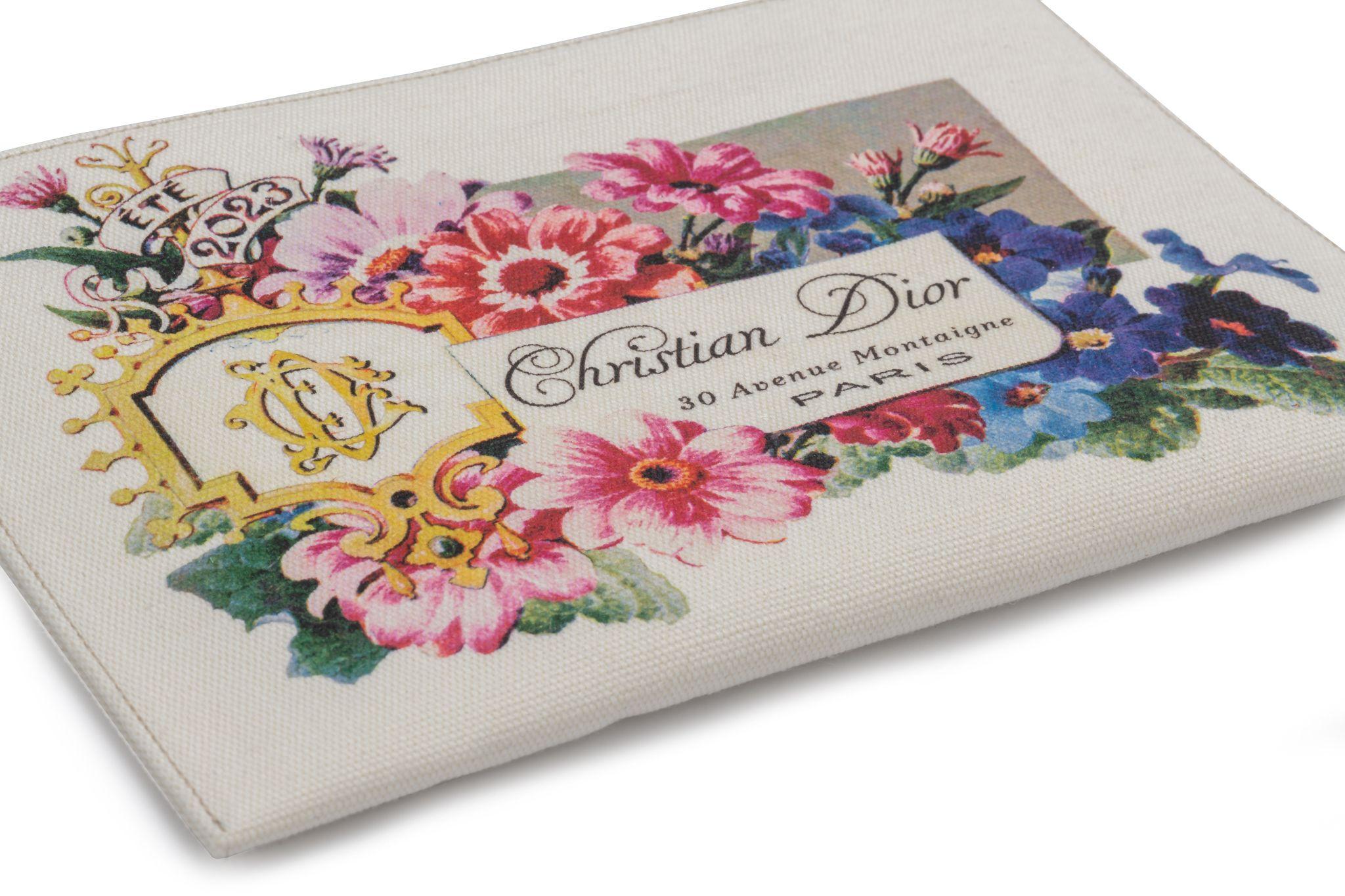 CHRISTIAN DIOR Ete 2023 30 Avenue Montaigne Paris floral print canvas zip pouch in white. It's new and comes with the original dustcover.