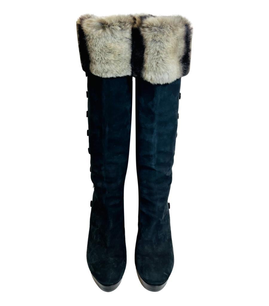 Dior Nubuck Leather & Rex Rabbit Fur Trimmed Knee-High Boots

Black boots designed with grey rex rabbit fur trimmed cuff and black snap closure along the sides with 'Dior' inscription to one button.

Featuring almond toe with platform and stiletto