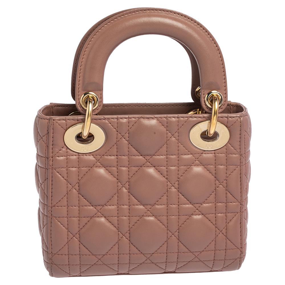 The Lady Dior tote is a Dior creation that has gained recognition worldwide and is today a coveted bag that every fashionista craves to possess. This tote has been crafted from leather and it carries the signature Cannage quilt. It is equipped with