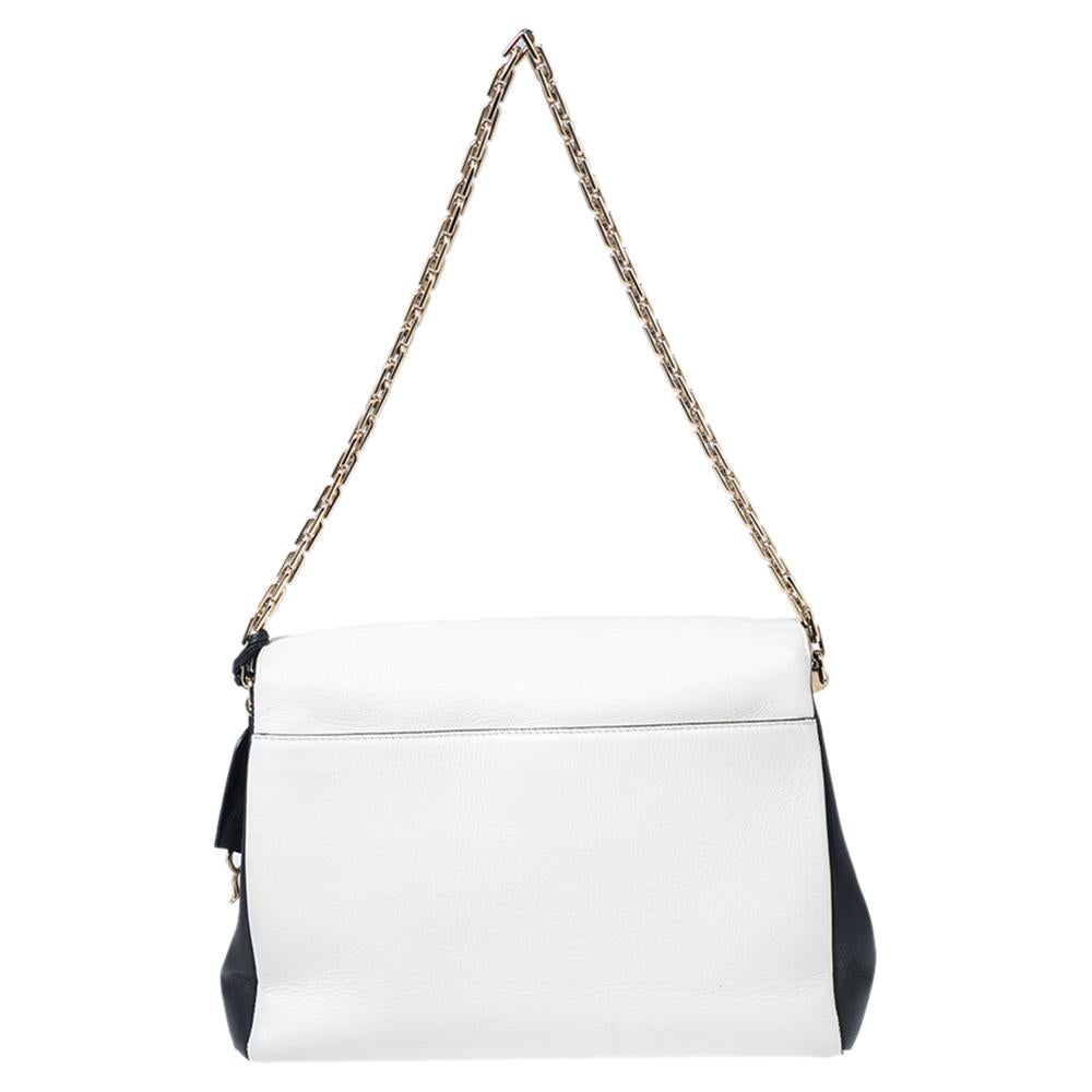 Dior Diorling bag was introduced in Spring/Summer 2013 Collection. Made from off-white and black smooth leather, the bag features a spacious interior that is separated into two compartments to let you organize your essentials neatly. It comes with a