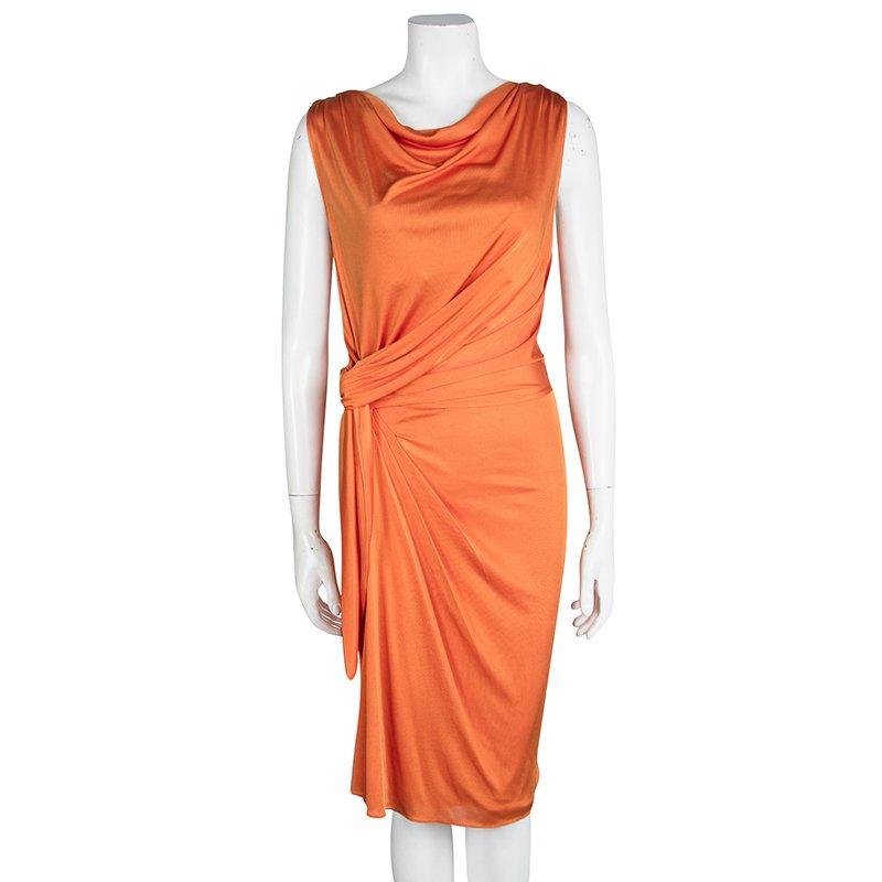 This Dior dress is here to make you look your best. Designed with an orange hue, a cowl neck, and drapes at the front, the sleeveless dress will look perfect with a glittering clutch and matching sandals.

Includes: The Luxury Closet Packaging

The