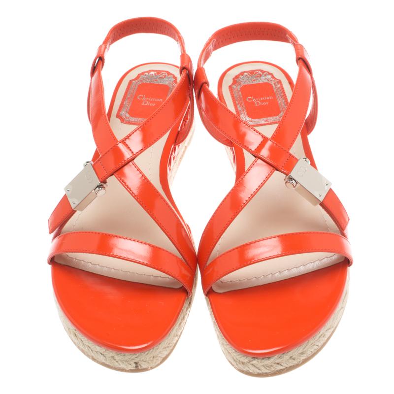 These espadrille flat sandals from Dior promise to not only provide you with a lot of comfort but also add to your chic style! The vibrant orange sandals are crafted from leather and feature an open toe silhouette. They flaunt silver-tone hardware