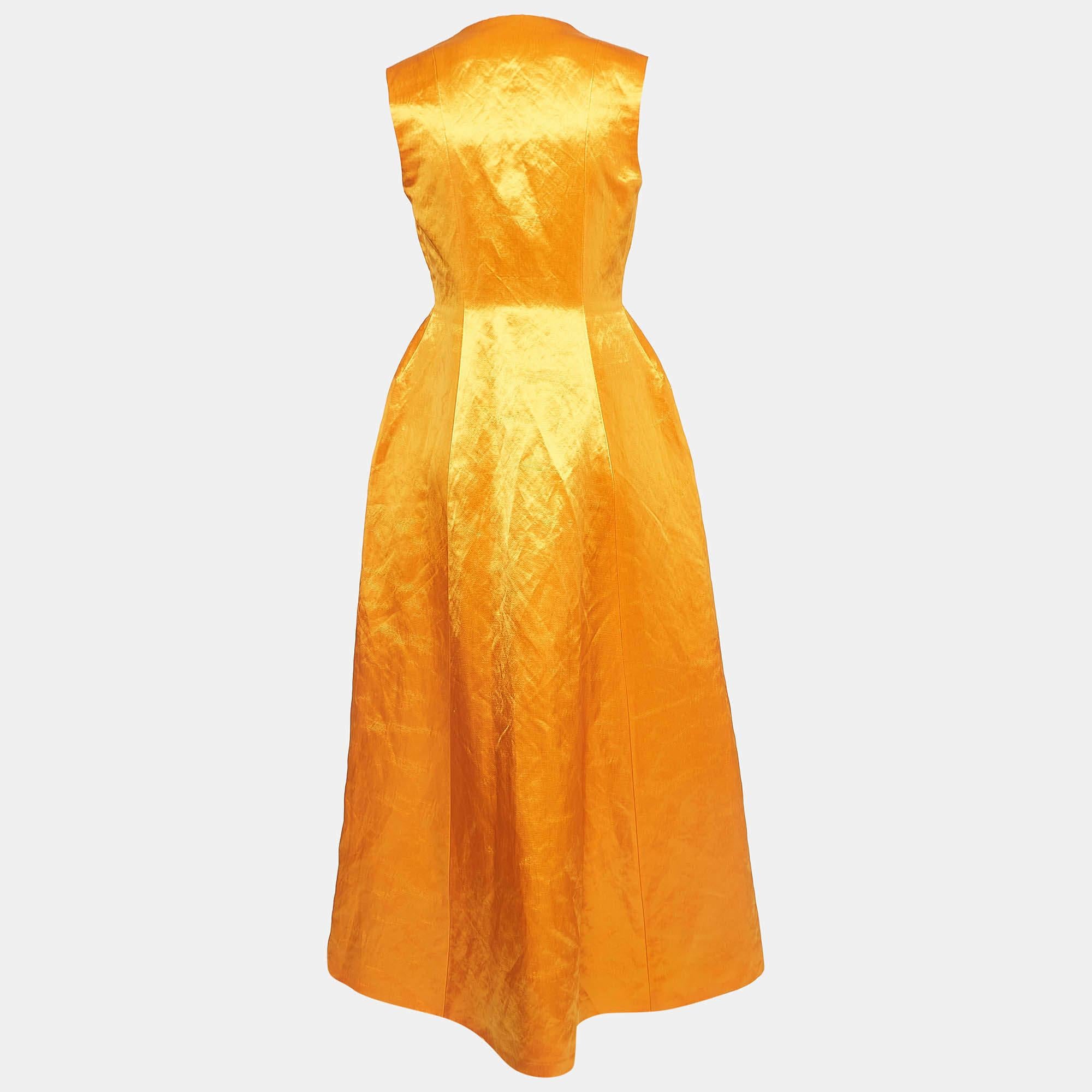 A gorgeous orange hue and elegant cuts elevate the charm of this Dior maxi dress. Tailored using satin, the creation has a cinched waist and hook closure for the desired fit. Complement this dress with an evening clutch and slingback heels for the