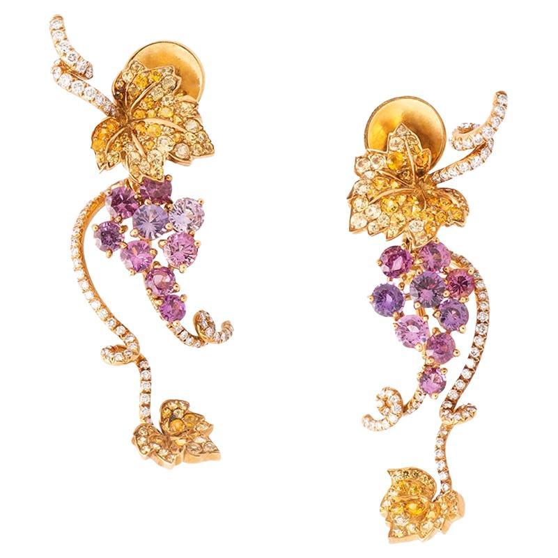 Dior
Pair of coloured sapphire and diamond earrings
Designed as a stylised bunch of grapes, set with circular-cut pink and yellow sapphires, enhanced with brilliant-cut diamonds, signed Dior and numbered.

Each signed Dior, numbered A2370. Stamped