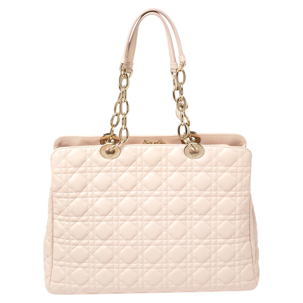 The Lady Dior tote is a Dior creation that has gained recognition worldwide and is today a coveted bag that every fashionista craves to possess. This pale pink tote has been crafted from leather and it carries the signature Cannage quilt. It is