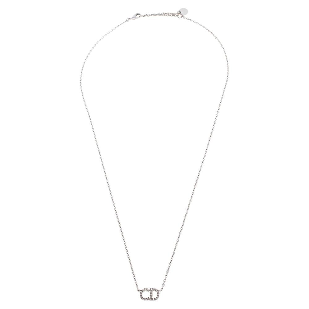 Sometimes, the simplest of designs are the most breathtaking. This utterly beautiful Clair D Lune necklace is by Dior. It has been crafted from silver-tone metal and the chain holds the signature CD motifs as the pendant decorated with