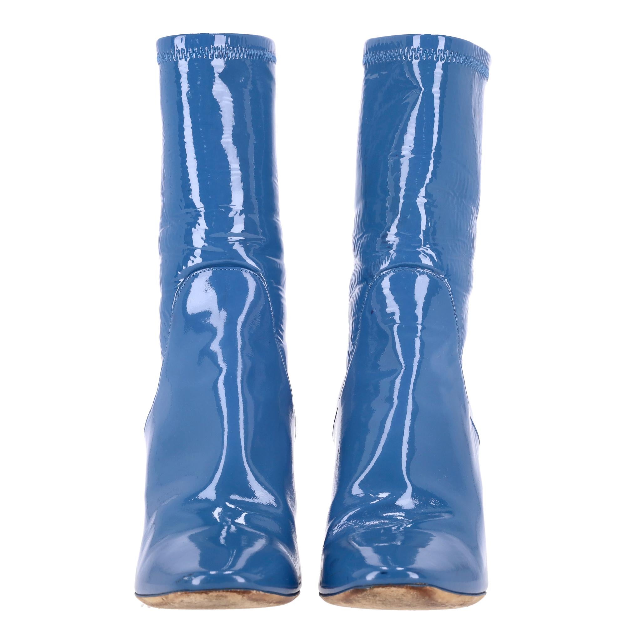 Rare Item - Dior Patent Leather Boots With Perspex Crystal Detailed Heels

Blue patent leather ankle boots designed with sculptural transparent heel embellished with crystal detailed base.

Featuring silver 'Dior' engraved signature to rear, almond