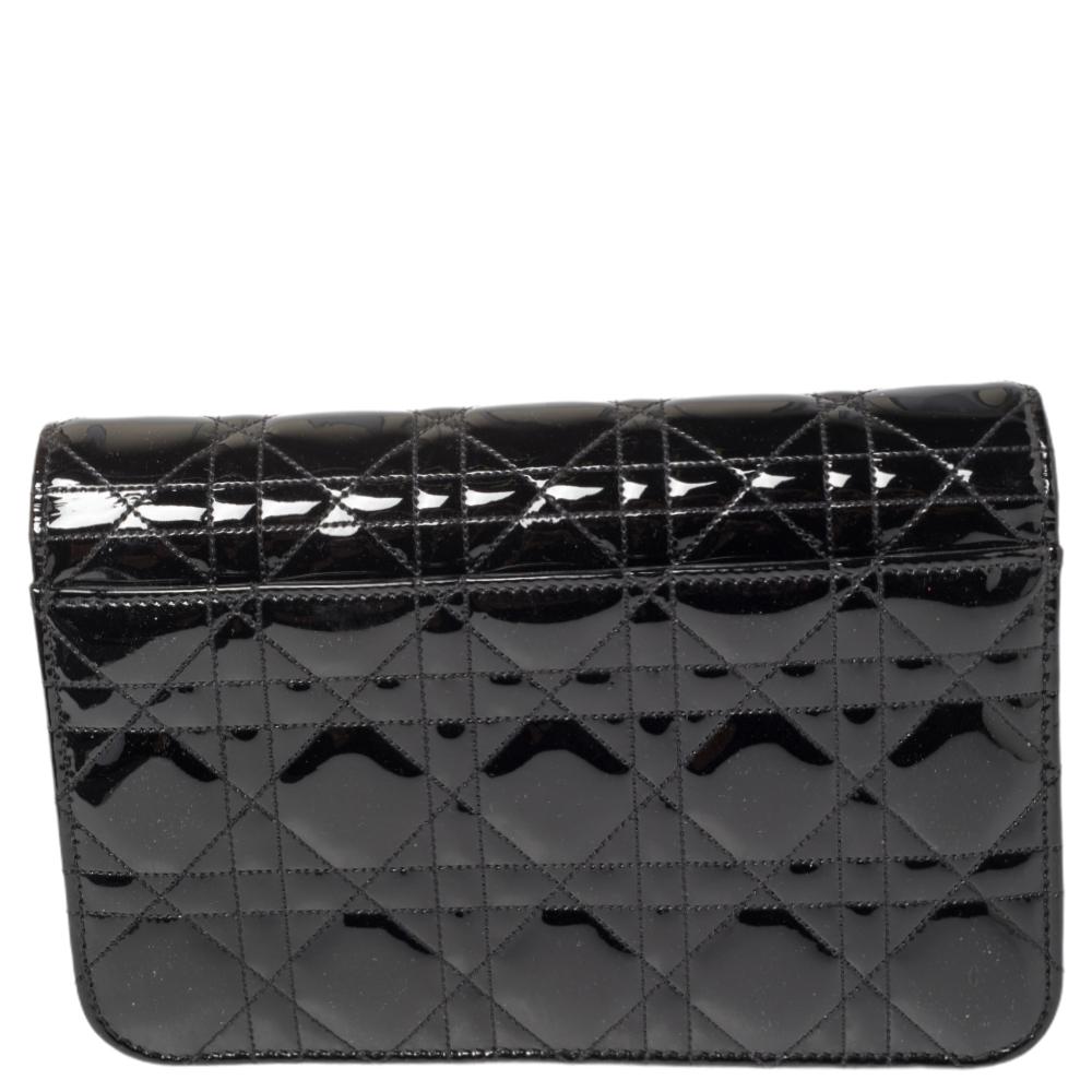 Flap bags like this Miss Dior Promenade will never go out of style. Crafted from patent leather, this Dior flap bag features a Cannage exterior and a chain strap. The front flap has a Dior lock that opens to a leather and fabric-lined interior with