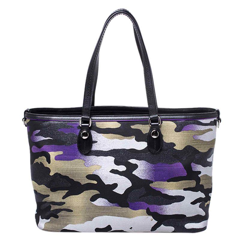 This bag was designed for Dior by Anselm Reyle, an artist from Berlin. He mixed colours and camouflage prints on canvas to create this stunning tote. The Cannage pattern is also laid in a slanting manner for a sense of movement. The bag is held by