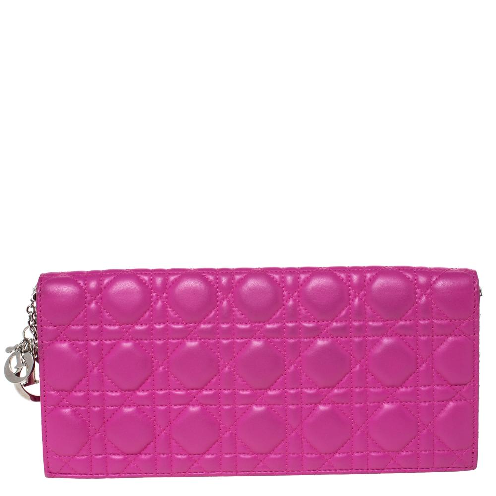 This Lady Dior clutch is a coveted bag that every fashionista craves to possess. This pink wallet has been crafted from leather and it carries the signature Cannage quilt. It is equipped with a fabric interior featuring a slip pocket and an open