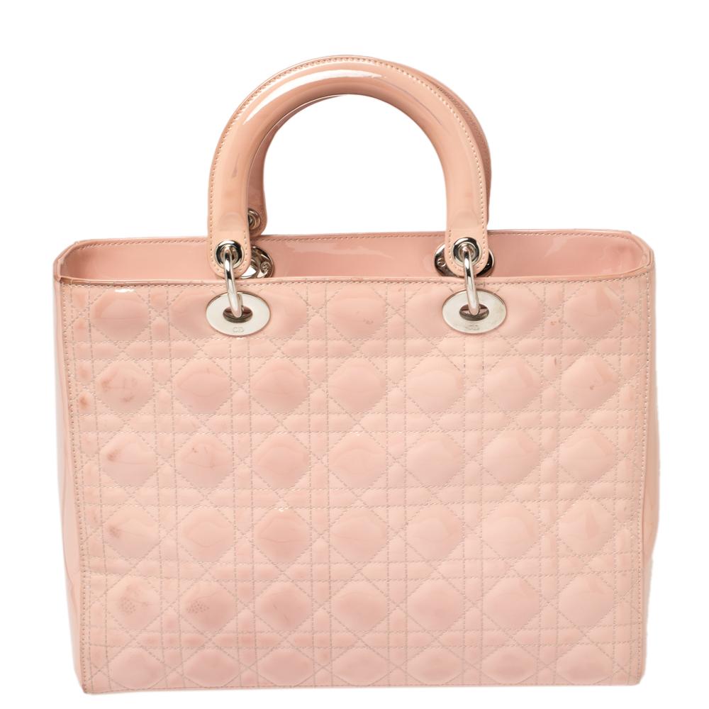 The Lady Dior tote is a Dior creation that has gained recognition worldwide and is today a coveted bag that every fashionista craves to possess. This pink tote has been crafted from patent leather and it carries the signature Cannage quilt. It is