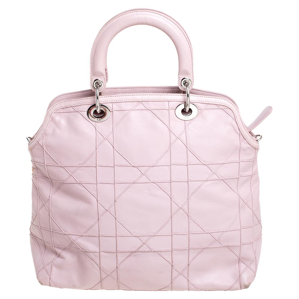 This Granville tote from Dior is a bag that every fashionista craves to possess. The bag has been crafted from leather, and it carries a pink exterior accented with the signature cannage pattern. It is equipped with a spacious interior, two handles,