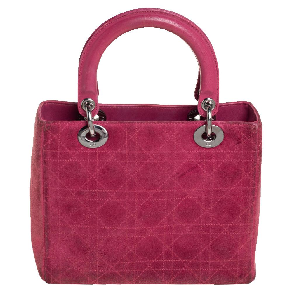 The Lady Dior tote is a Dior creation that has gained recognition worldwide and is today a coveted bag that every fashionista craves to possess. This pink tote has been crafted from leather and suede and it carries the signature Cannage quilt. It is