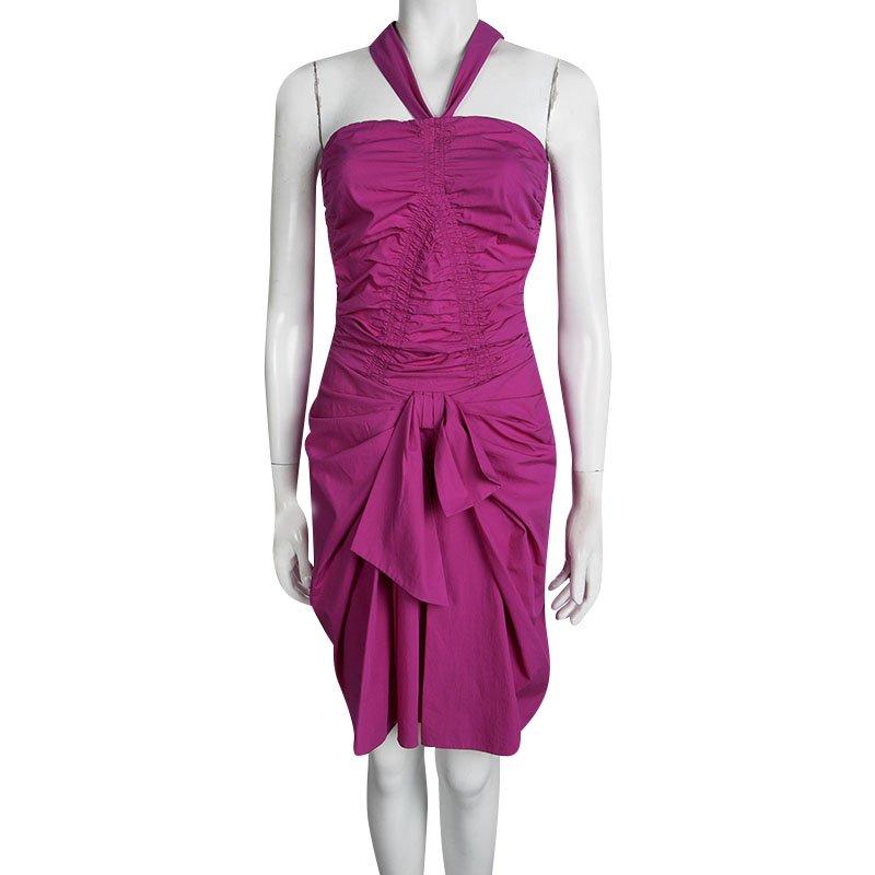 Sashay out like a diva in this Dior Halter Dress that was created in Italy from cotton. Designed with a halter neck, and a ruched design with a bow detail, this striking pink dress is complete with a zip fastening at the back. Assemble the complete