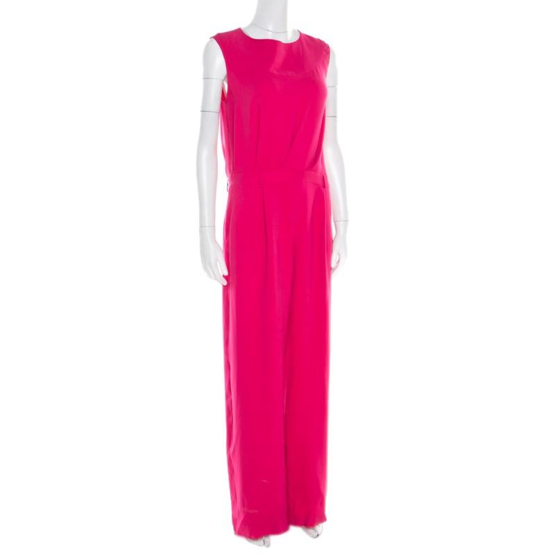 Hold the attention of everyone as you walk into a room wearing this charming jumpsuit from Dior. Look smart and appealing in this pink outfit which is styled with a draped back accented beautifully with tie detail at the neckline. Dazzle your way